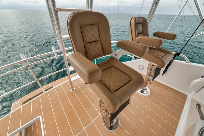 Slide: The Image of Luxurious seating on a 2001 Viking 65 yacht with ocean view. - 21