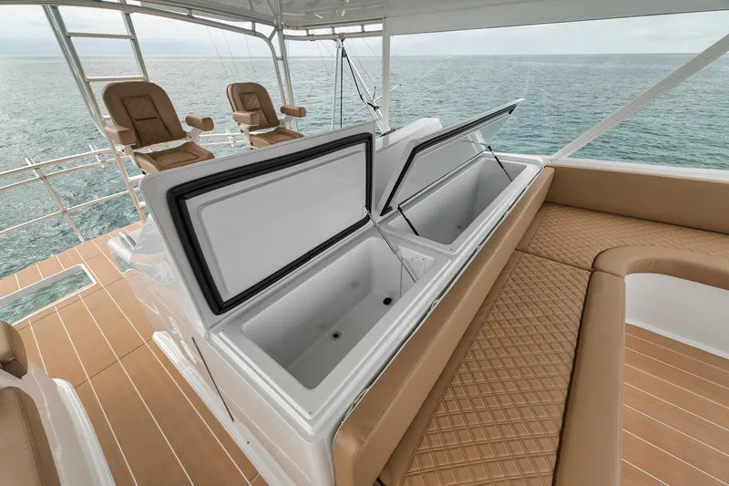 Slide: The Image of Luxury seating and storage on a 2001 Viking 65 yacht, overlooking the ocean. - 27