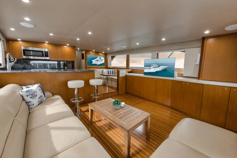 Slide: The Image of Luxurious interior of a 2001 Viking 65 yacht with modern kitchen and seating area. - 36
