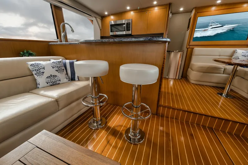 Slide: The Image of Luxurious interior of 2001 Viking 65 yacht with modern kitchen and seating area. - 37