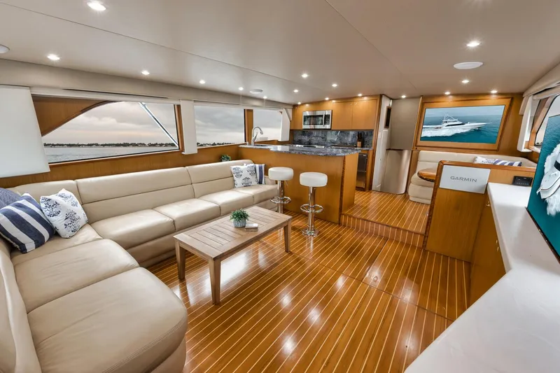 Slide: The Image of Luxurious interior of a 2001 Viking 65 yacht with elegant seating and modern amenities. - 38