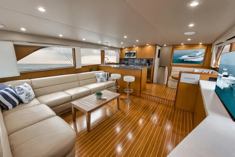 Slide: The Image of Luxurious interior of 2001 Viking 65 yacht with modern furnishings and wooden flooring. - 40
