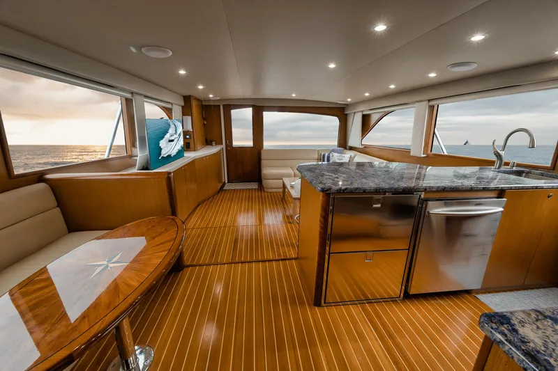 Slide: The Image of Luxurious interior of a 2001 Viking 65 yacht with modern kitchen and ocean view. - 44