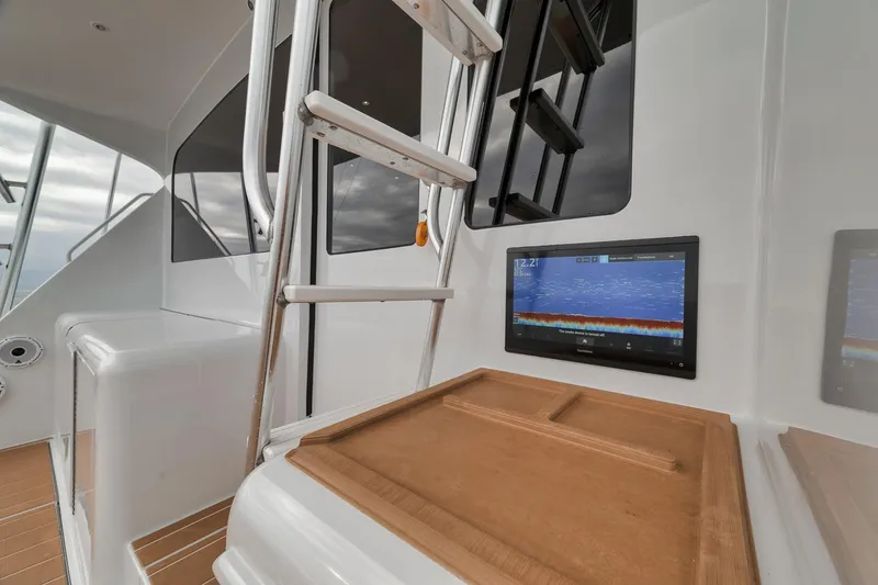 Slide: The Image of 2001 Viking 65 yacht interior with ladder and navigation screen. - 49
