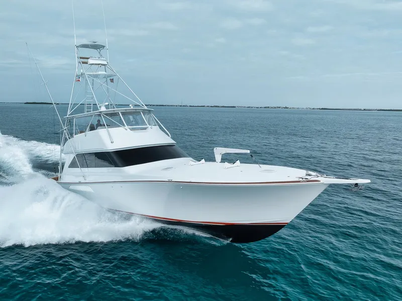 Slide: The Image of 2001 Viking 65 yacht cruising on open water, showcasing sleek design and powerful performance. - 8