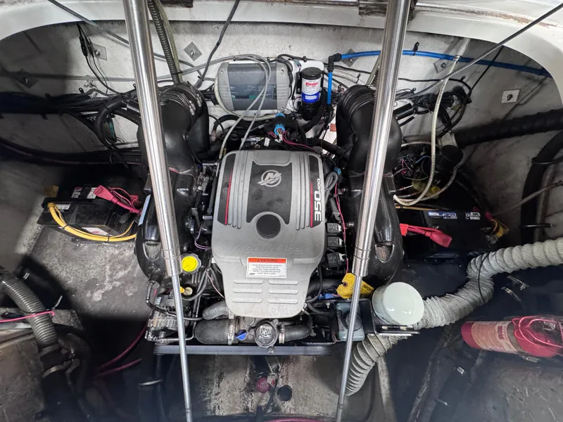 Slide: The Image of Engine compartment of a 2011 Crownline 245 SS boat, showcasing detailed mechanical components. - 12