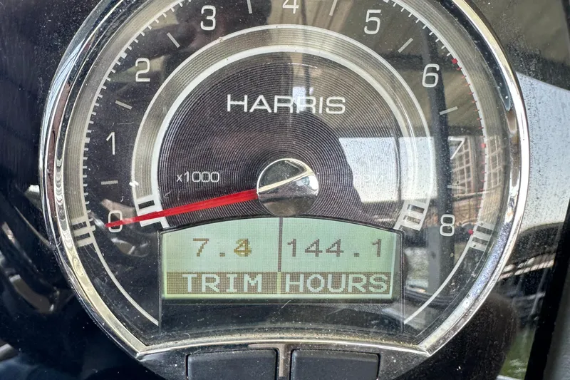 Slide: The Image of Close-up of 2019 Harris Solstice 240 gauge displaying trim hours and RPM. - 14