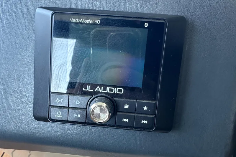 Slide: The Image of JL Audio MediaMaster 50 control panel in 2019 Harris Solstice 240 boat. - 17