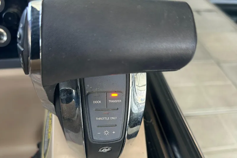 Slide: The Image of Throttle control of 2019 Harris Solstice 240 boat with illuminated indicators. - 18
