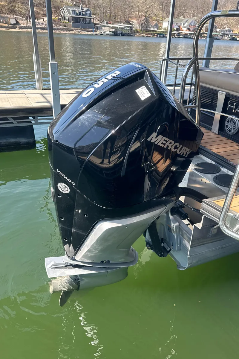 Slide: The Image of 2019 Harris Solstice 240 with Mercury outboard motor on a lake. - 20