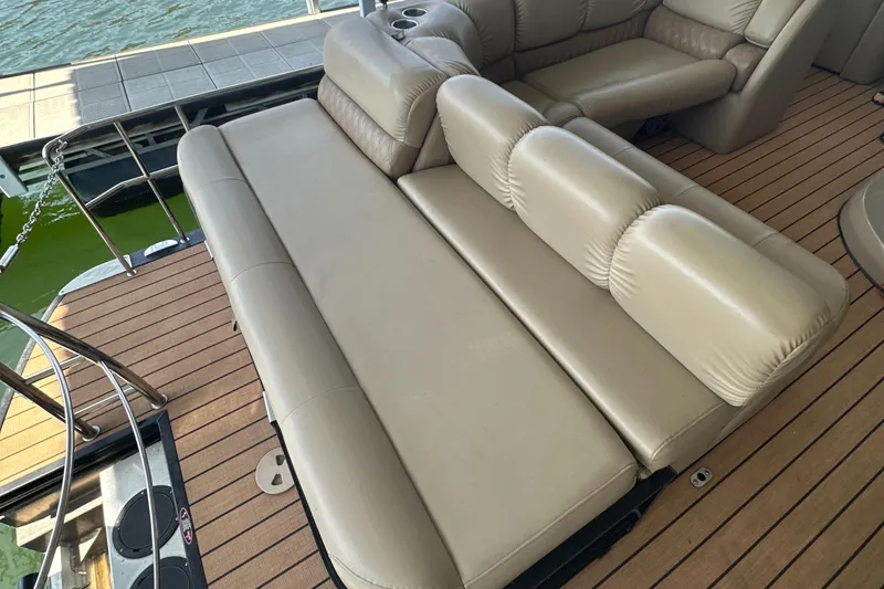 Slide: The Image of Luxurious seating on 2019 Harris Solstice 240 boat with beige leather upholstery. - 25