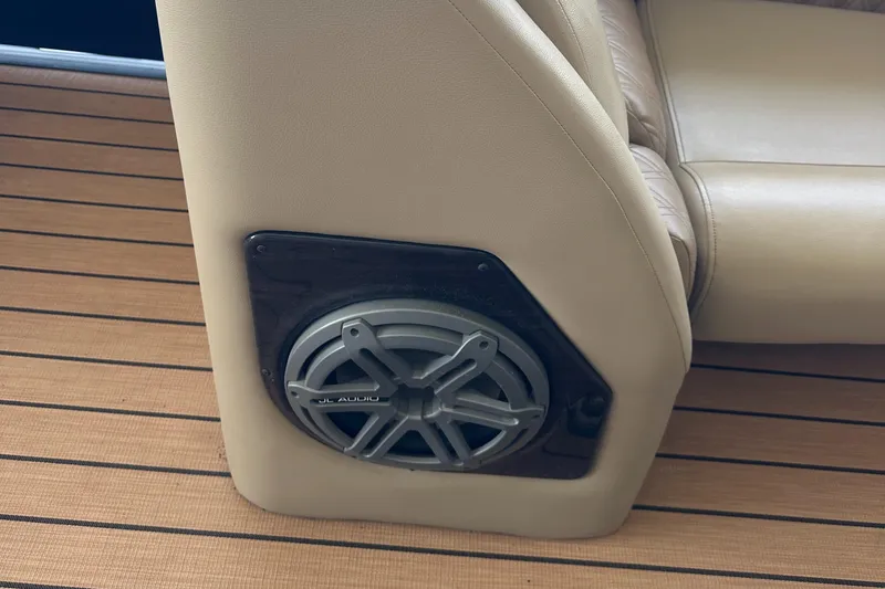 Slide: The Image of Speaker installed on a 2019 Harris Solstice 240 boat's beige seating. - 26