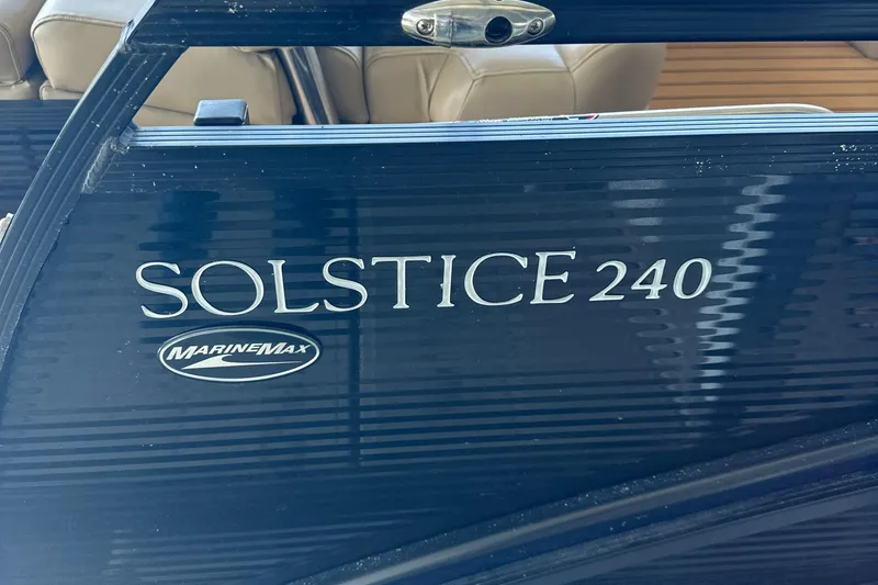 Slide: The Image of 2019 Harris Solstice 240 boat with MarineMax logo on dark blue exterior. - 29