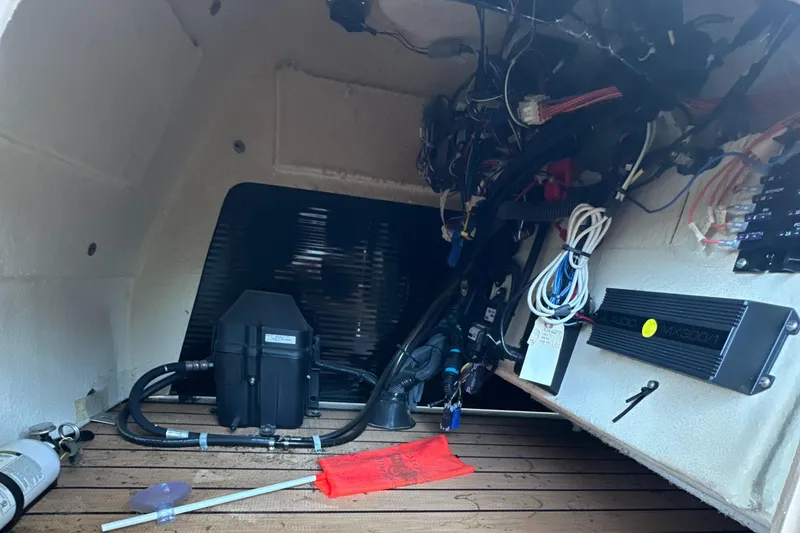 Slide: The Image of Interior view of 2019 Harris Solstice 240 boat showing wiring and equipment. - 31