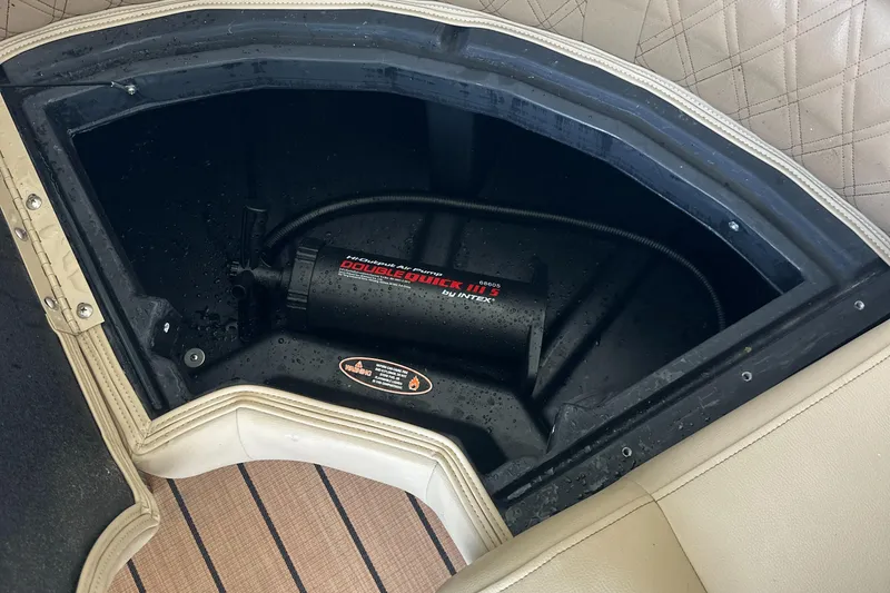 Slide: The Image of Storage compartment in a 2019 Harris Solstice 240 boat with a pump inside. - 37