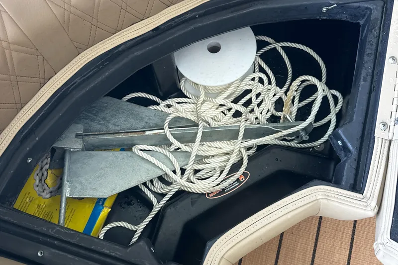 Slide: The Image of Storage compartment in a 2019 Harris Solstice 240 boat with anchor and rope. - 38