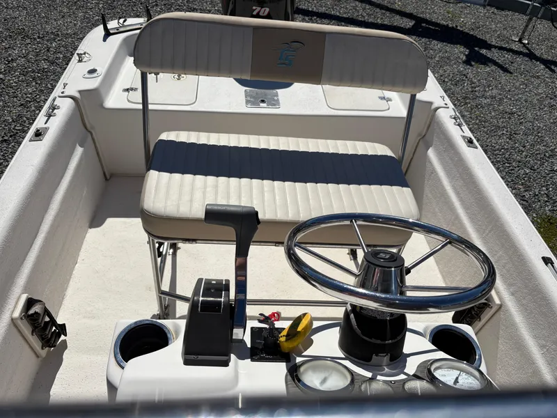 Slide: The Image of 2017 Carolina Skiff 18JVX boat interior with steering wheel and seating. - 10