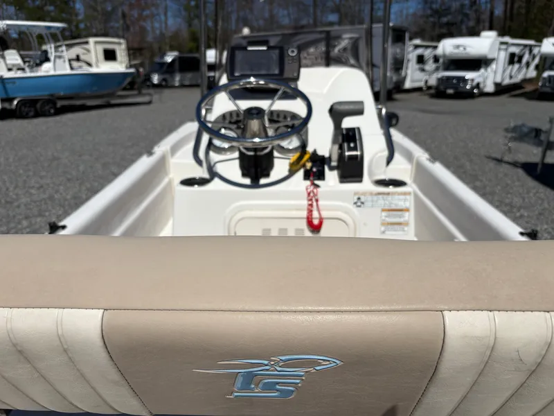 Slide: The Image of 2017 Carolina Skiff 18JVX boat interior with steering wheel and control panel. - 7