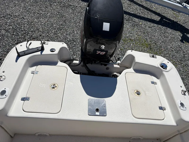 Slide: The Image of 2017 Carolina Skiff 18JVX boat with outboard motor, rear deck view. - 9