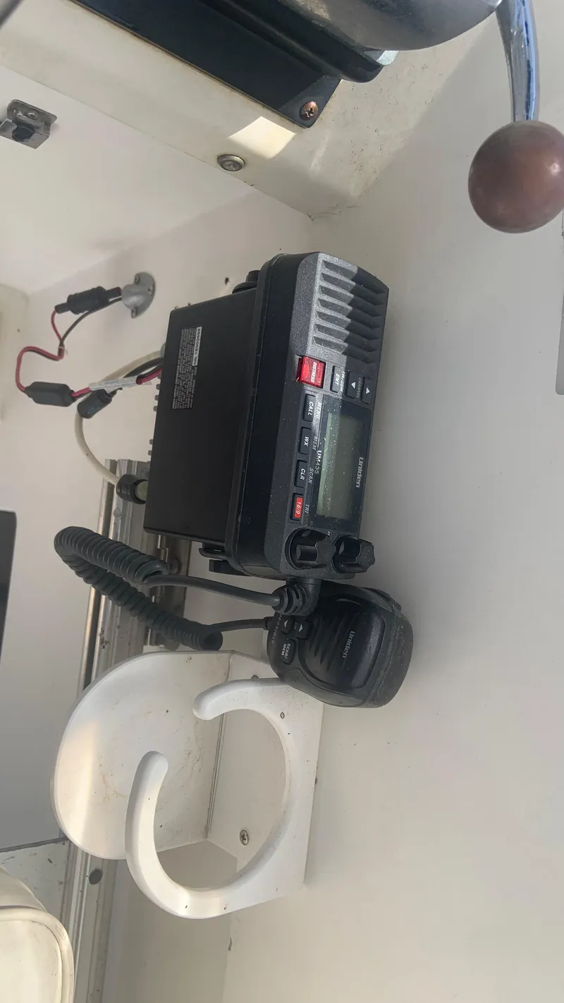 Slide: The Image of 1987 Luhrs Alura 30 boat radio equipment with microphone and controls. - 12