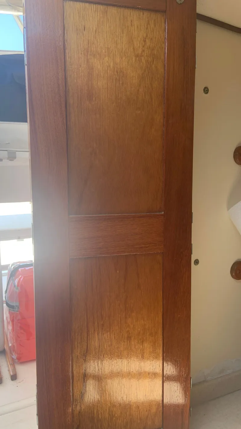 Slide: The Image of Wooden interior panel on a 1987 Luhrs Alura 30 boat. - 22