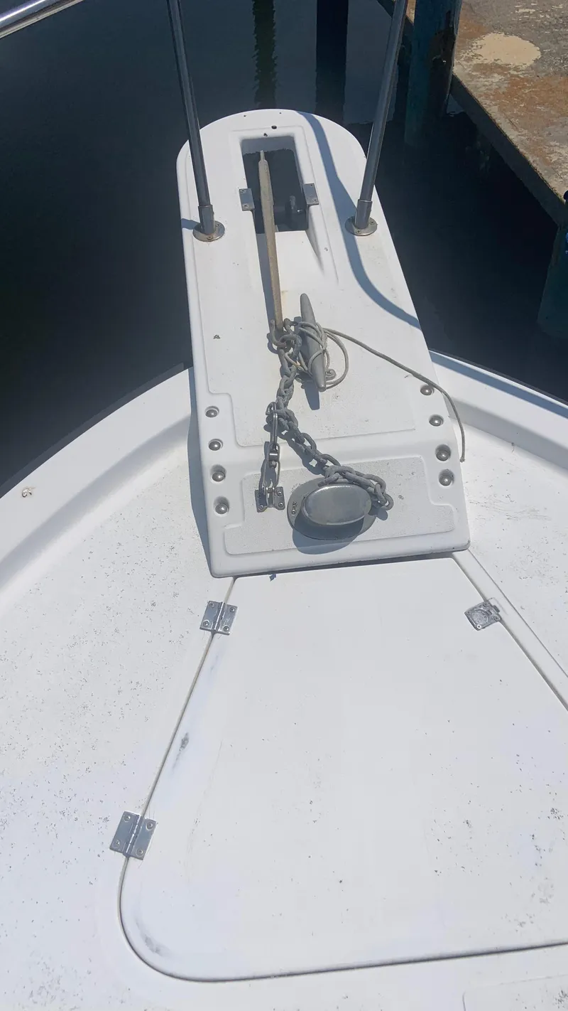 Slide: The Image of 1987 Luhrs Alura 30 boat deck with anchor chain and winch. - 26