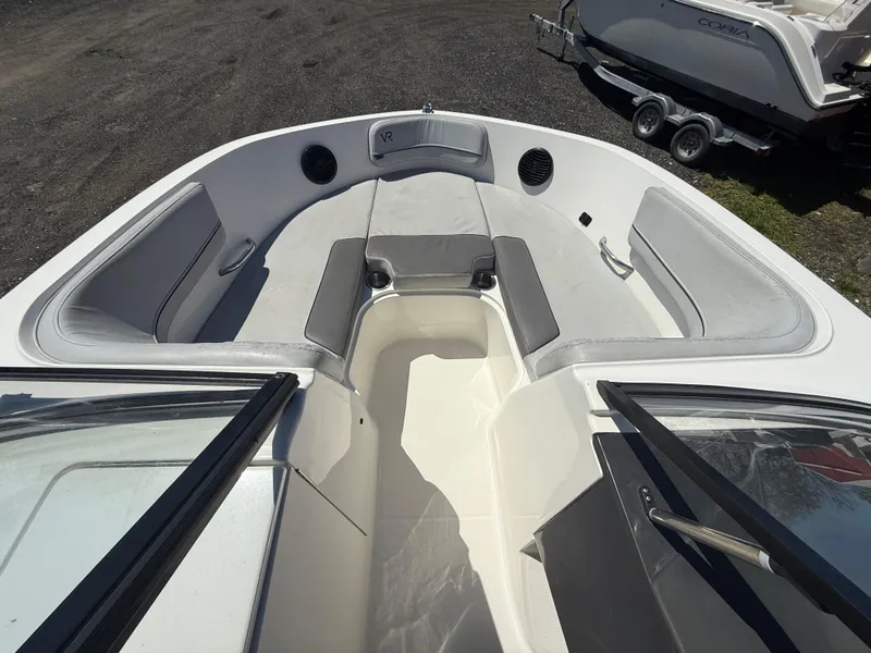 Slide: The Image of 2022 Bayliner VR6 Bowrider OB interior with spacious seating and modern design. - 10
