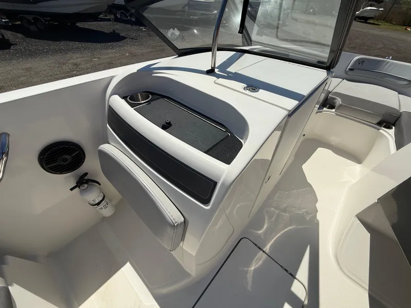 Slide: The Image of 2022 Bayliner VR6 Bowrider OB interior with seating and storage compartments. - 12