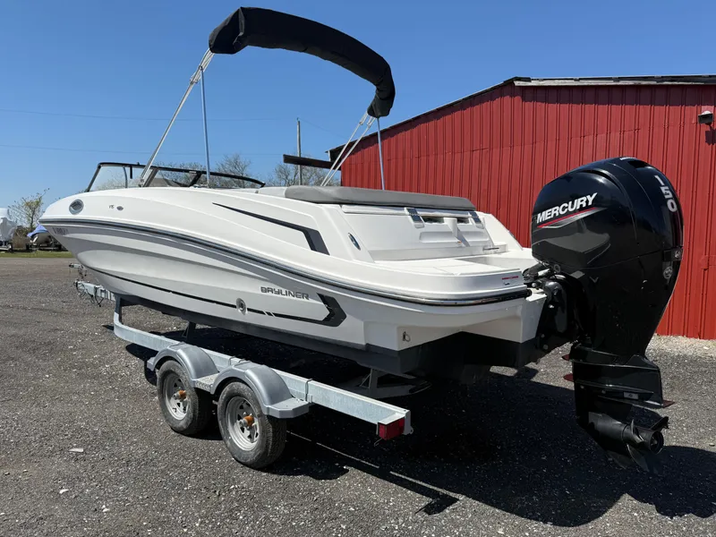 Slide: The Image of 2022 Bayliner VR6 Bowrider OB on trailer, featuring Mercury outboard engine, parked near red building. - 3