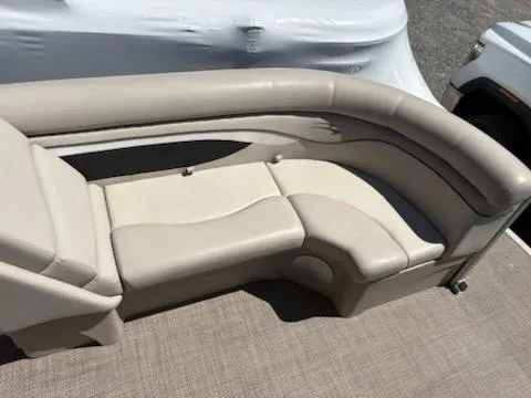 Slide: The Image of 2019 Bennington 22SLX boat interior with beige seating and carpeted flooring. - 5