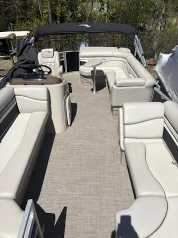 Slide: The Image of 2019 Bennington 22SLX pontoon boat with spacious seating and modern interior design. - 7