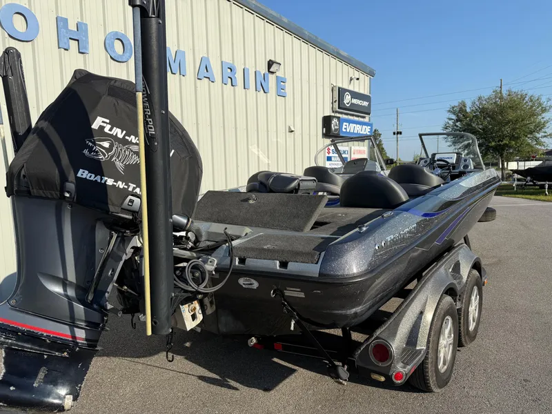 Slide: The Image of 2017 Ranger 212LS Reatta boat on trailer outside marine dealership. - 14