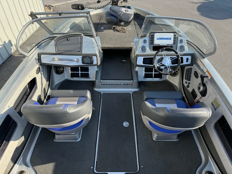 Slide: The Image of 2017 Ranger 212LS Reatta boat interior with dual seats and navigation system. - 8