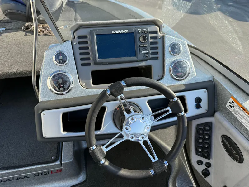 Slide: The Image of 2017 Ranger 212LS Reatta boat dashboard with Lowrance GPS and steering wheel. - 9