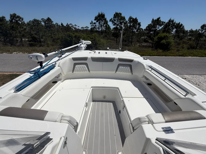 Slide: The Image of 2021 World Cat 280 DC-X boat on trailer under clear blue sky. - 11