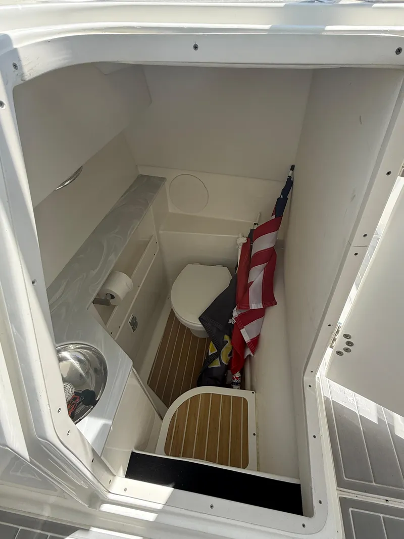 Slide: The Image of 2021 World Cat 280 DC-X boat on trailer, featuring dual Mercury outboard engines. - 15