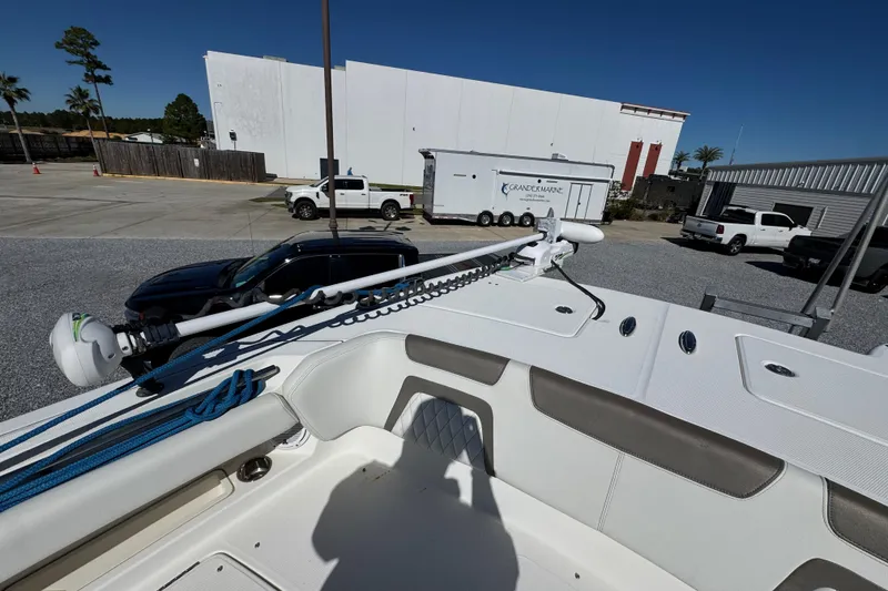 Slide: The Image of 2021 World Cat 280 DC-X boat in parking lot, featuring deck and equipment. - 17