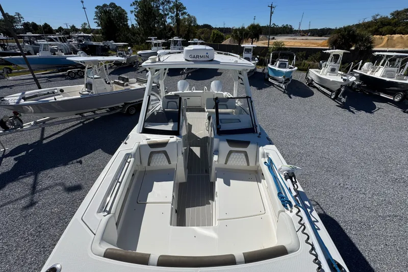 Slide: The Image of 2021 World Cat 280 DC-X boat displayed in a marina with other vessels. - 19