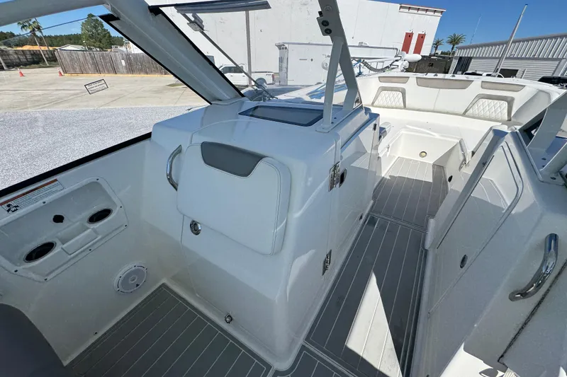 Slide: The Image of 2021 World Cat 280 DC-X boat interior with seating and storage compartments. - 25