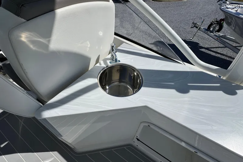 Slide: The Image of 2021 World Cat 280 DC-X boat sink and seating area in sunlight. - 27