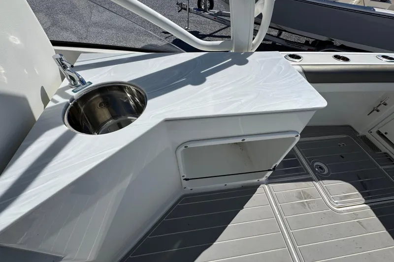 Slide: The Image of 2021 World Cat 280 DC-X boat interior with sink and countertop. - 28