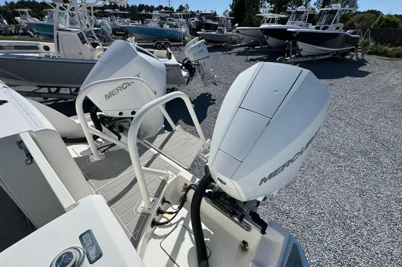 Slide: The Image of 2021 World Cat 280 DC-X with dual Mercury outboard engines in a boatyard. - 33