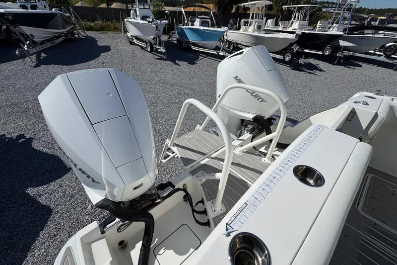 Slide: The Image of 2021 World Cat 280 DC-X boat with dual Mercury outboard engines in a marina. - 34