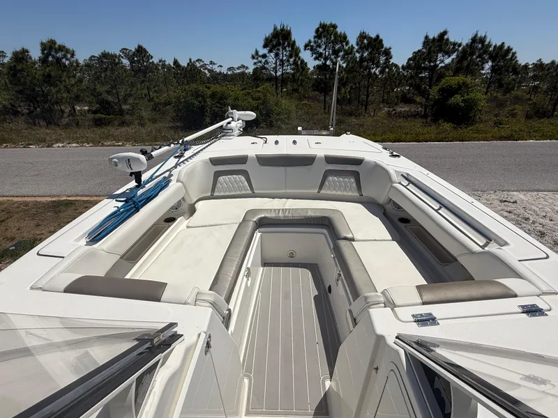 Slide: The Image of 2021 World Cat 280 DC-X boat displayed in a sunny outdoor showroom. - 5