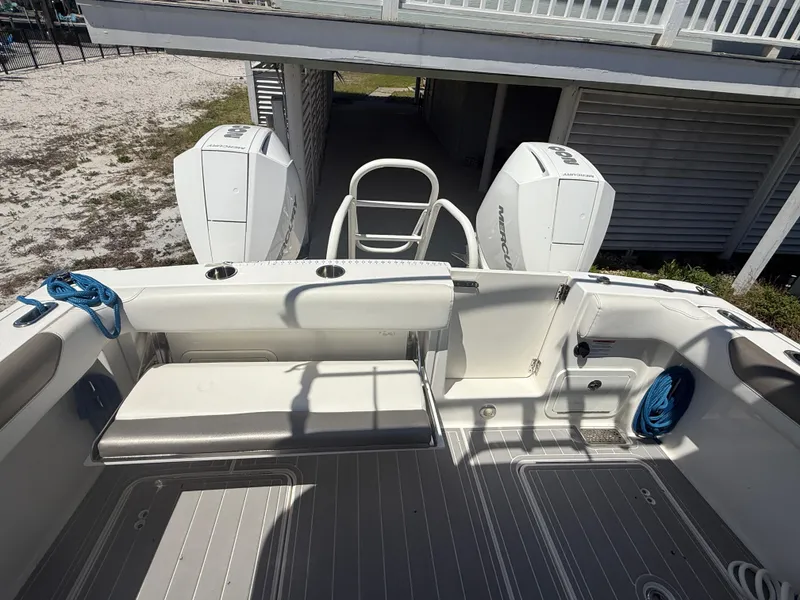 Slide: The Image of 2021 World Cat 280 DC-X boat displayed under clear blue sky. - 6