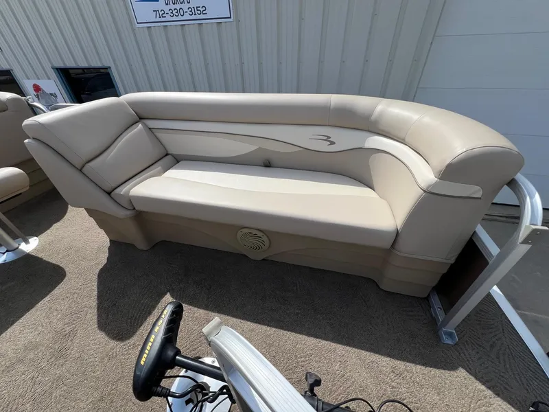 Slide: The Image of Beige seating on 2012 Bennington 24 SL boat, outdoor setting. - 10