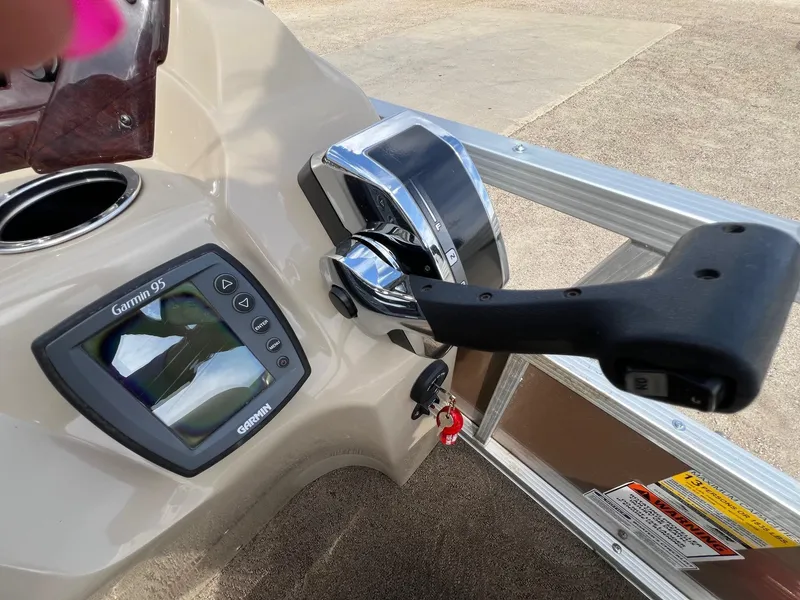 Slide: The Image of Control panel of a 2012 Bennington 24 SL boat with Garmin 95 device. - 16