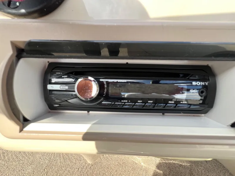 Slide: The Image of Sony stereo system in a 2012 Bennington 24 SL boat dashboard. - 18