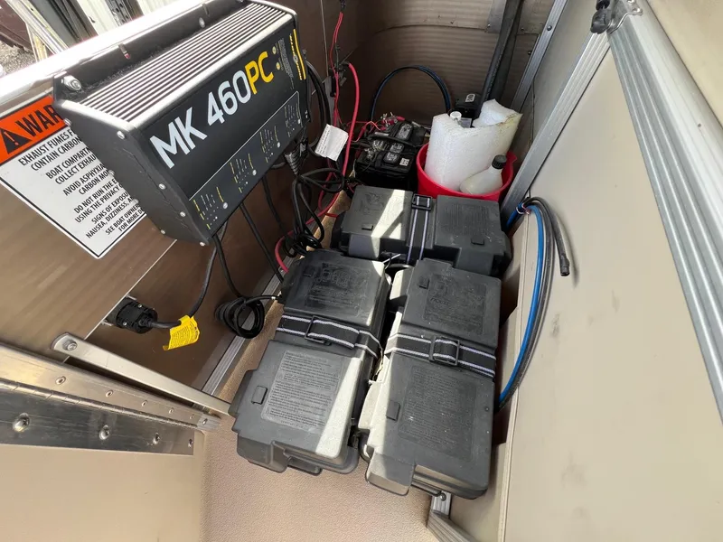 Slide: The Image of Battery compartment of a 2012 Bennington 24 SL with MK 460PC charger. - 21