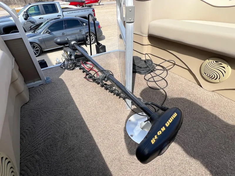 Slide: The Image of 2012 Bennington 24 SL boat interior with Minn Kota trolling motor. - 8